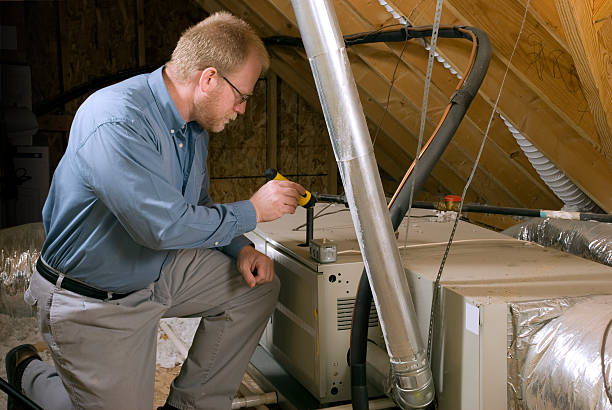 Worker inspecting a furnace
